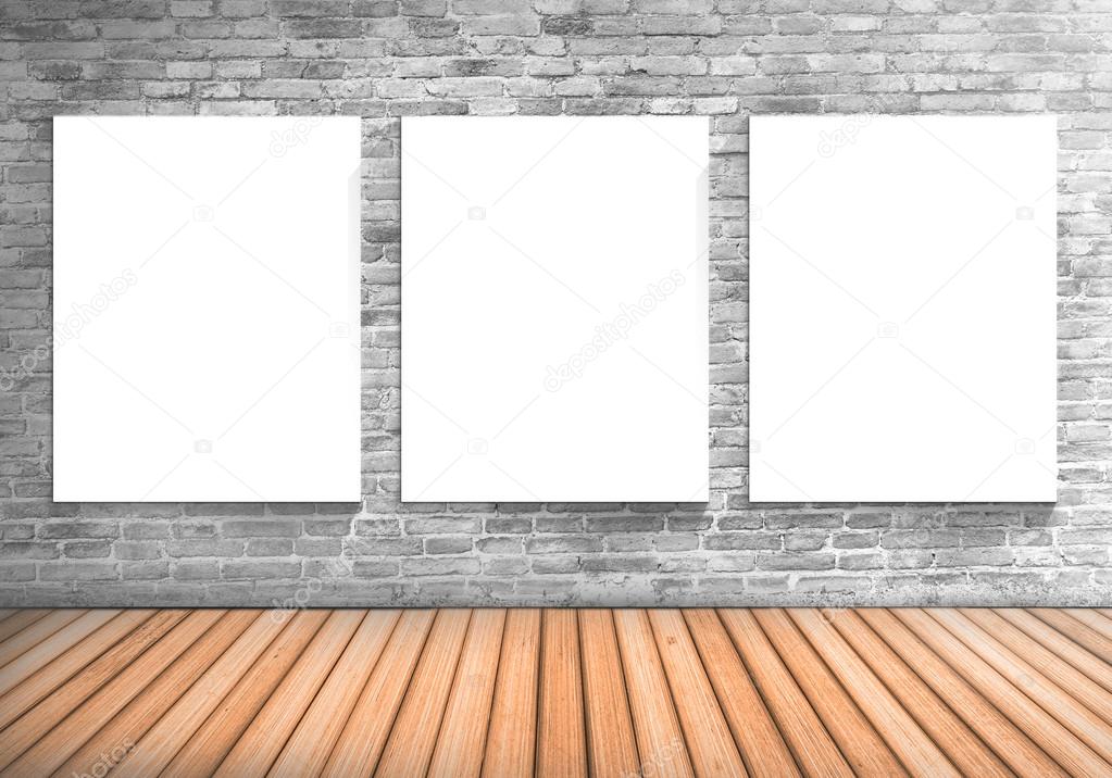 Blank frame three white board on a concrete blick wall and woode