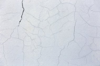 Çimento-Beton Sanayi duvar ile mavi arka plan çatlamak.