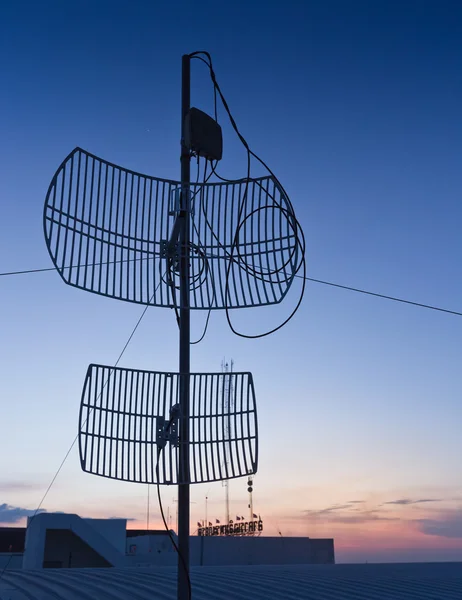 Antenna silhouette on sunset. — Stock Photo, Image