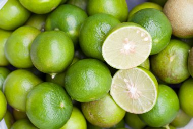 Close up fresh green lemon the top.