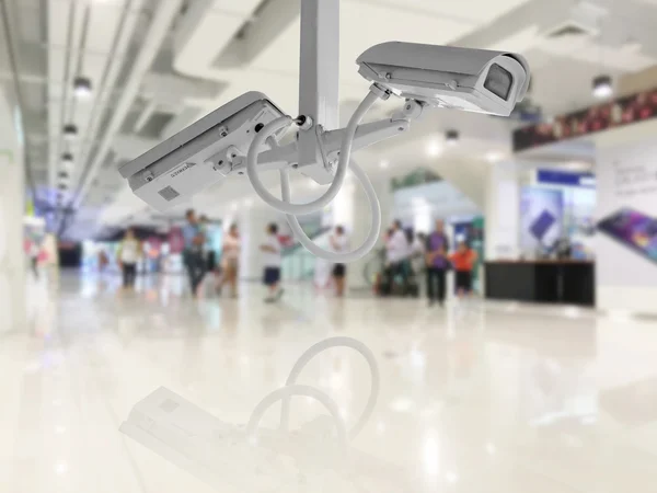 CCTV Security camera shopping department store background. — Zdjęcie stockowe