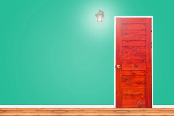 Wooden door and lamp with isolated green vintage wall texture. — Φωτογραφία Αρχείου
