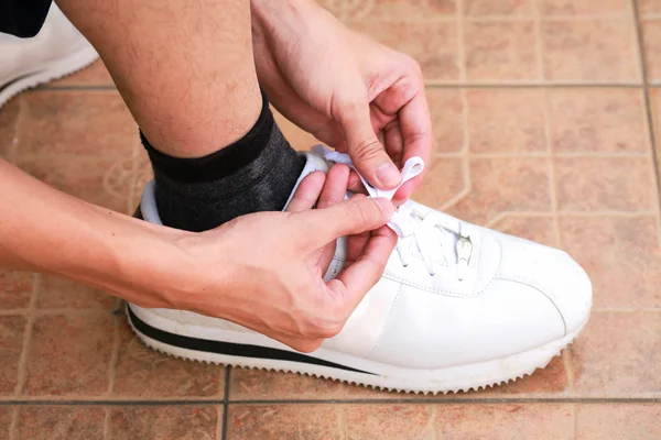 Tying sport shoes prepart running start. — Stock Photo, Image