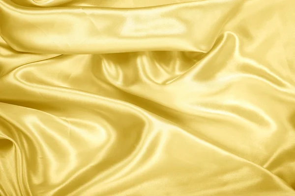 Ouro fablic cetim na textura de fundo . — Fotografia de Stock