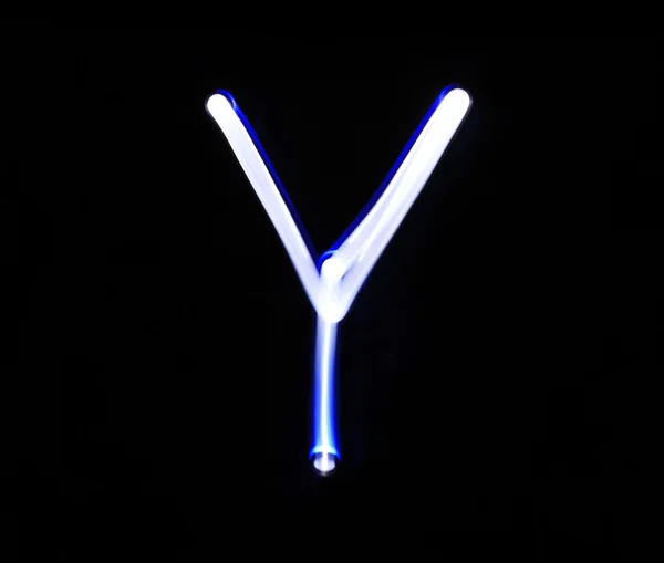 Y Yankee abeceda ručně psaného modré světlo na černém pozadí — Stock fotografie