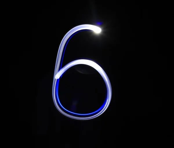 Six blue light digit hand writing over black background. — Stock Photo, Image