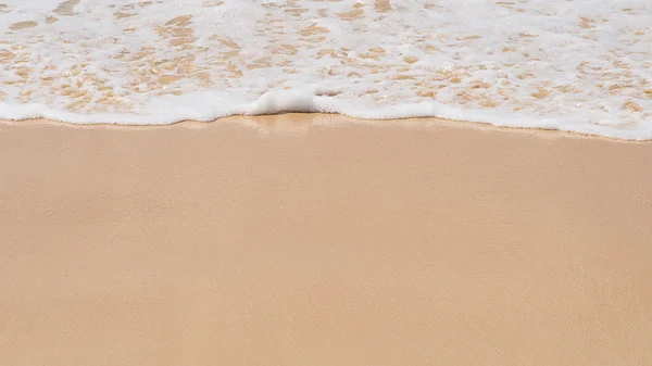 Sand background with wave. Beautiful sand background and wave from sea. Sand Texture background. Closeup of sand.