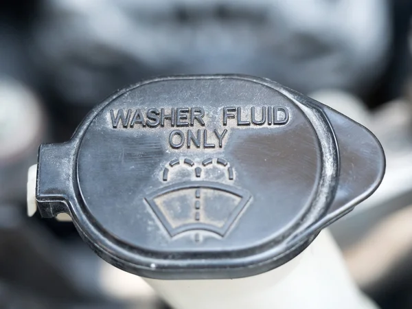 Washer fluid. Symbol of washer fluid.  Close up of black washer fluid inside car engine. — Stock Photo, Image