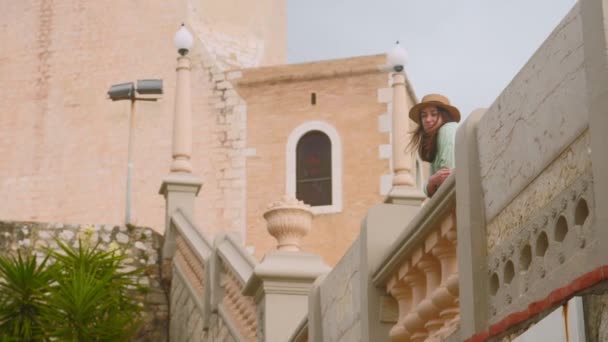 Young woman in hat watching on the sea Stock Video