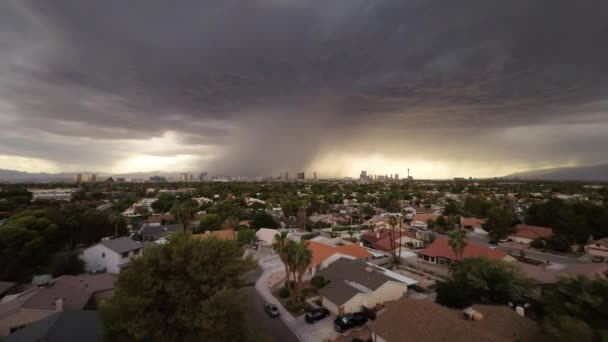 Flying over the buildings during a thunderstorm with a view of Las Vegas — Stock Video