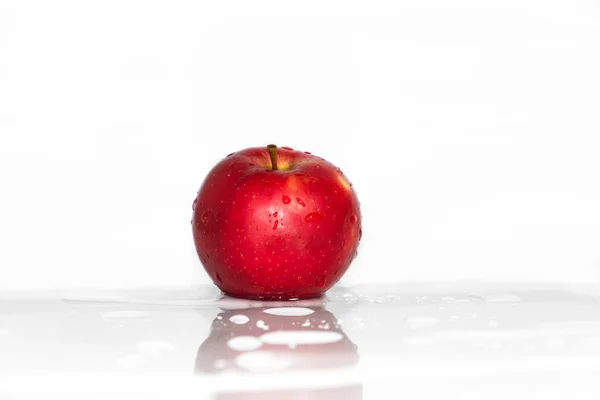 Red apple in water splashing — Stock Photo, Image