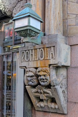 Detail from soapstone carvings flanking main entrance to Pohjola clipart