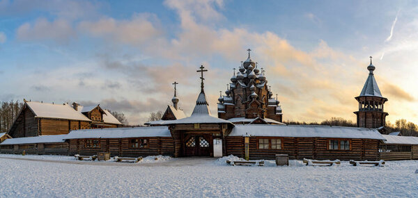 Restored orthodox wooden Twenty-five-headed Church of the Intercession of the Blessed Virgin Pokrovskaya at sunny winter day. St.Petersburg suburb, Russia.