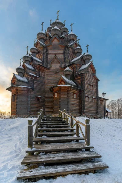 Restored orthodox timbered Twenty-five-headed Church of the Intercession of the Blessed Virgin Pokrovskaya at sunny winter day. St.Petersburg suburb, Russia.