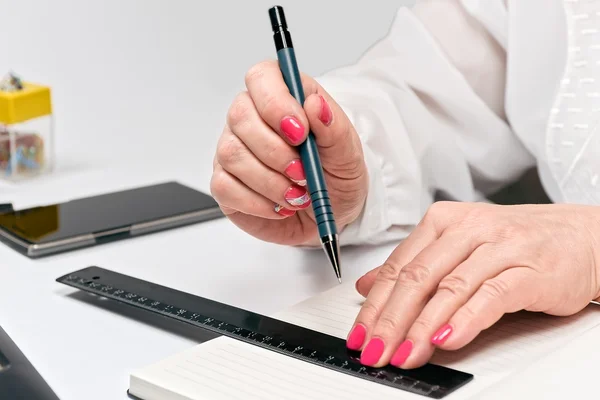 Close-up of female hands with laptop, smartphone and notebook — Stockfoto