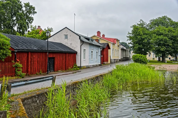 Old wooden houses on waterfront — Stockfoto