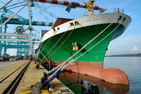 Large cargo ship being loaded in a port — Stock Photo, Image