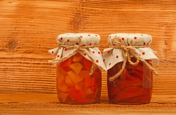 Two jars of quince jam at vintage wood — Stock Photo, Image