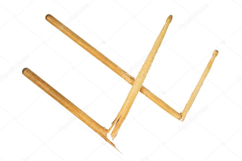 Two broken wooden drumsticks isolated on white
