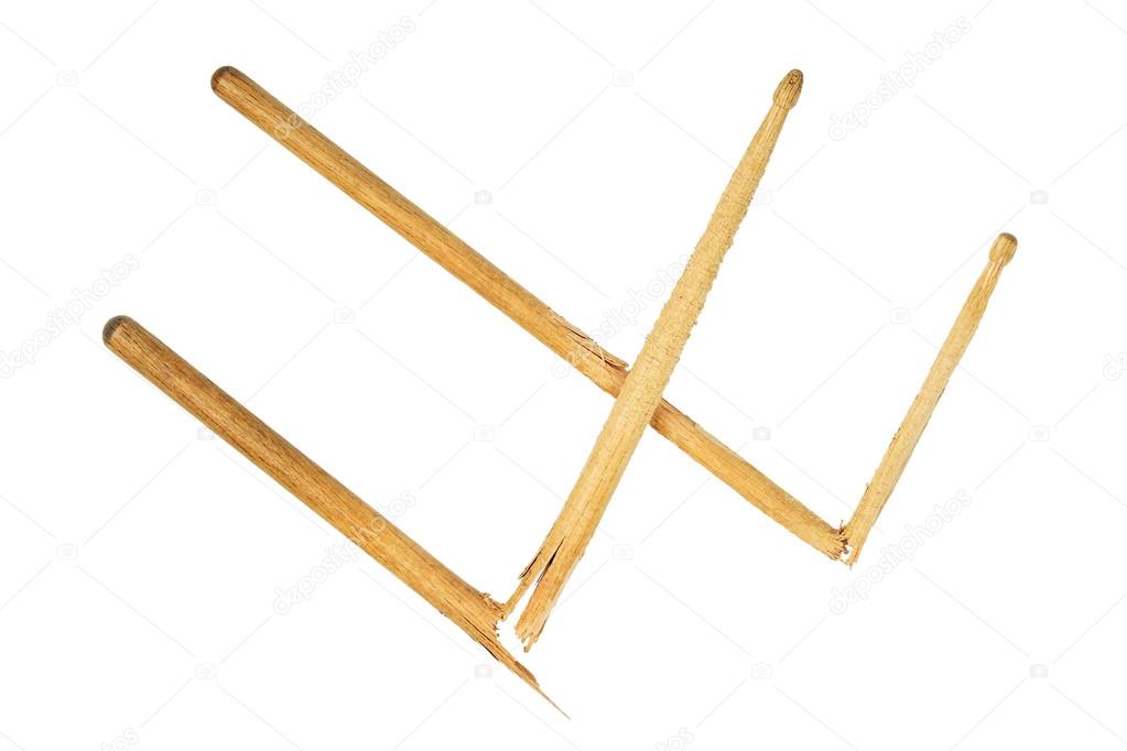 Two broken wooden drumsticks isolated on white Stock Photo by