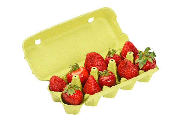 Strawberry in open green egg carrier over white