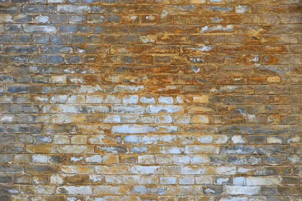 Old grunge brick wall with paint stains background — Stock Photo, Image
