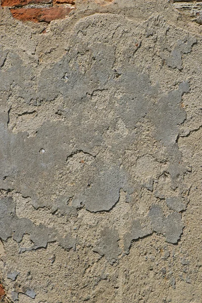 Parede de gesso cinza velho não pintado com rachaduras — Fotografia de Stock