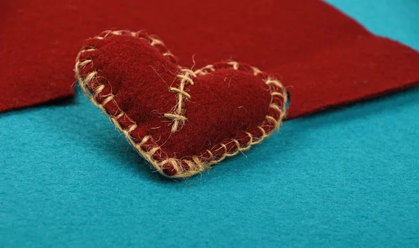 Felt craft and art brown heart cut out on blue — Stock Photo, Image