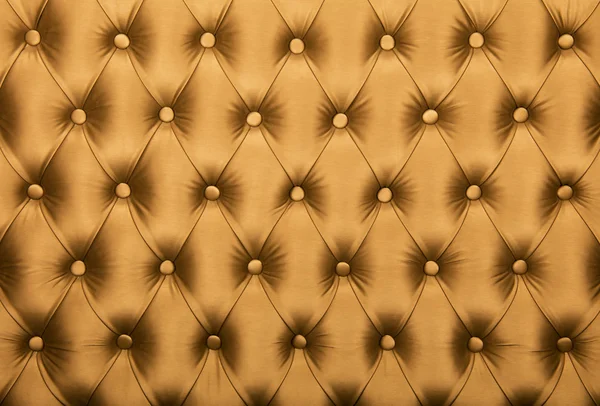 Golden capitone tufted fabric upholstery texture — Stock Photo, Image