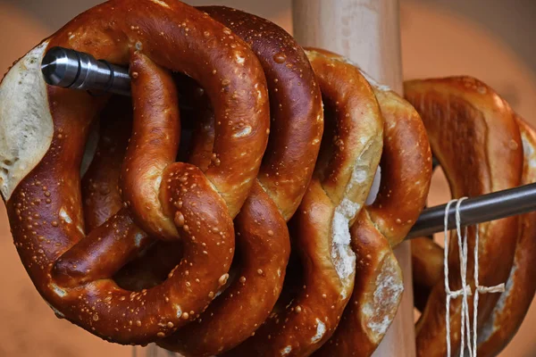 Close Several Fresh Traditional German Pretzel Bread Knots Hanging Retail — Stock Photo, Image