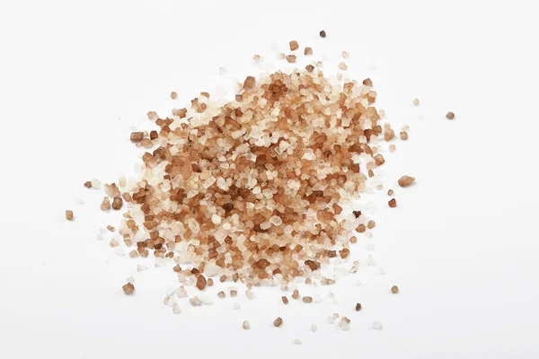 Handful of smoked Danish salt isolated on white