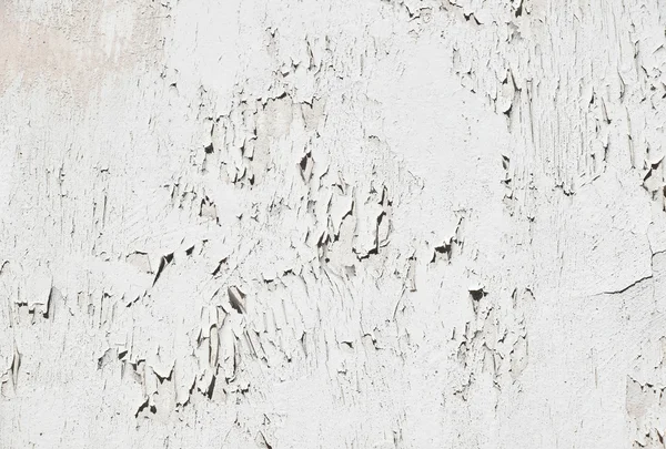 Vintage flakes of old white paint over grey concrete wall — Stock Photo, Image