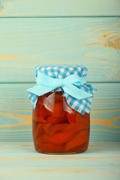 One jar of quince jam at blue vintage wood surface — Stock Photo, Image