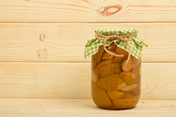 One jar of pear compote at beige vintage wood surface — Stock Photo, Image