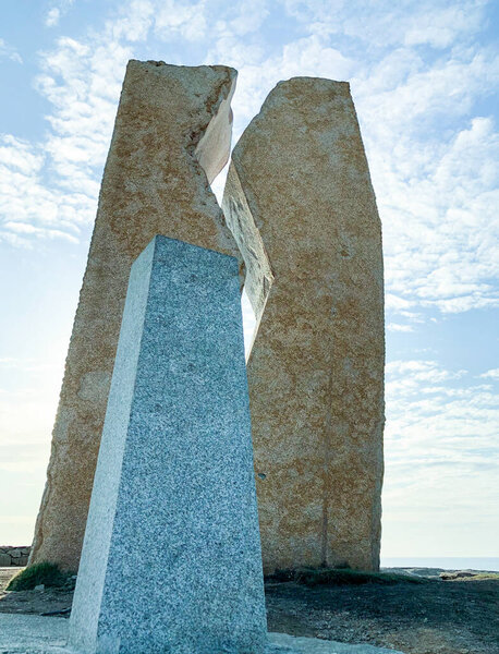 Raw of three stone sculptures in a hill in Galicia, Spain