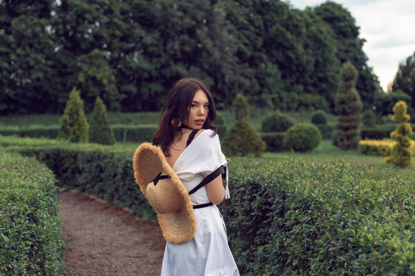 Walk with a girl in the summer garden