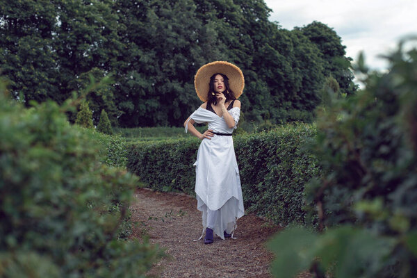 Walk with a girl in the summer garden