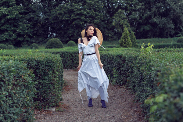 Walk with a girl in the summer garden