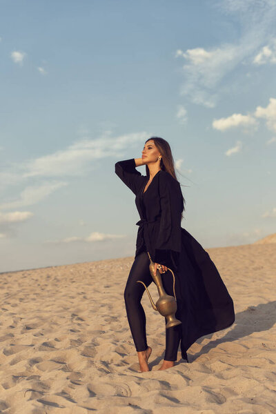 Muslim girl in the summer desert