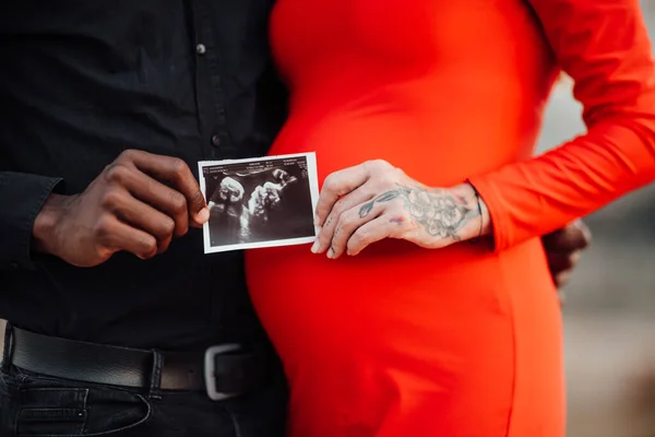 Couple Holding Ultrasound Photo Hands Pregnant Woman Wearing Stylish Red — Stock Photo, Image