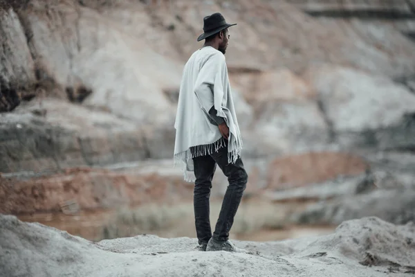 back view of african american man posing against granite canyon