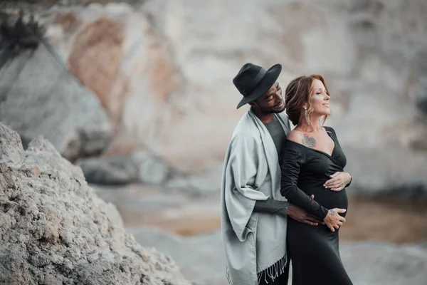 African American Man Hugging Pregnant Woman Black Dress Couple Posing — Stock Photo, Image