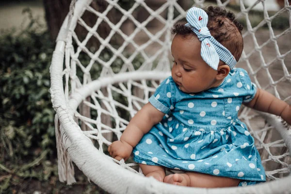 Outdoor Portrait Cute Little Girl Blue Dress Sitting Wicker Chair — Stock Photo, Image