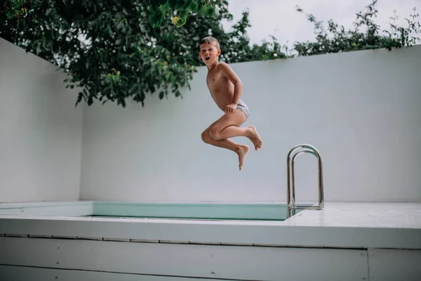 Happy Kid Jumping Swimming Pool Stock Photo