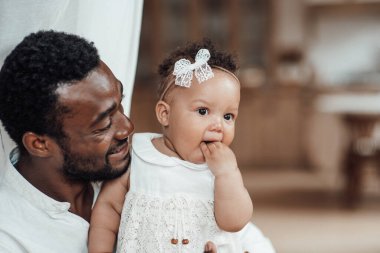 happy black man with his daughter