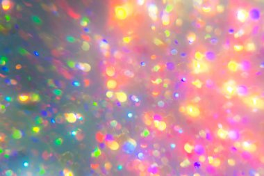 Pastel Renkli Bokeh Işık Arkaplanı. Bulanık holografik arka plan. Kaleydoskop ışını. Duvar kâğıdı partisi parlıyor. Parlak gökkuşağı neon sönmüş kaplama. Soyut bulanık parıltılı Clipart