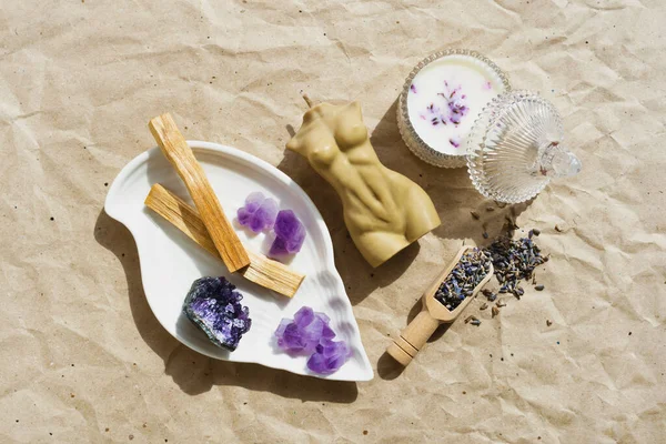Spiritual healing aromatherapy, meditation treatment. Candle, palo santo, agate mineral, dry lavender on natural background. Trendy mysticism, magic ritual. Balance, aura, harmony concept