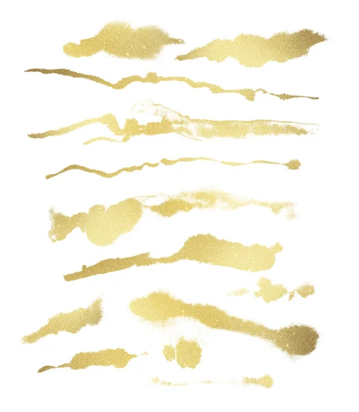 Many golden glitter stardust foil brushstroke isolated on white background. Foil texture diy design elements — Zdjęcie stockowe