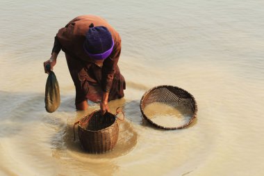 The NortheasternThailand woman and her fishing instruments