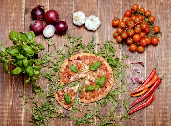 Delicious italian pizza served on wooden table. — Stock Photo, Image